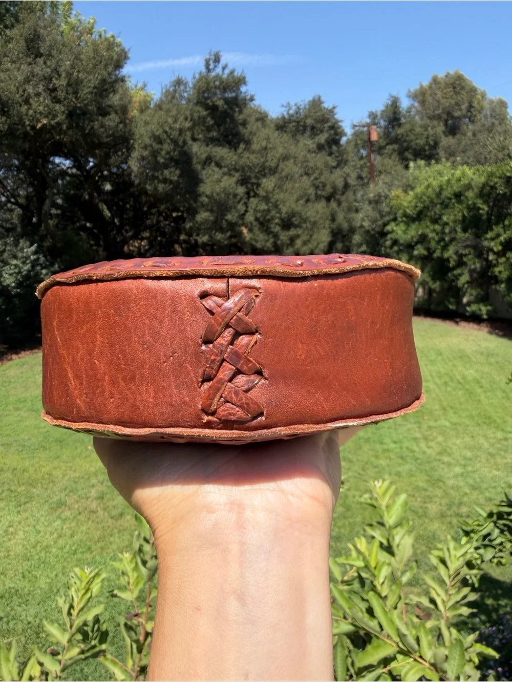 Hand-Tooled Round Leather Wristlet Bag with Colorful Woven Strap